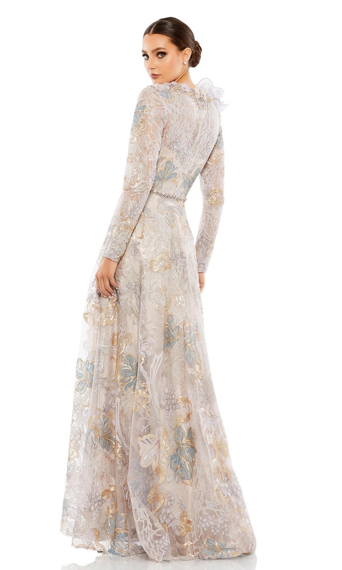 A woman models the Long Formal Dress 79374 by Mac Duggal—a floor-length, long-sleeved gown with floral shoulder embroidery and a fitted waist—as she looks over her shoulder against a white background.